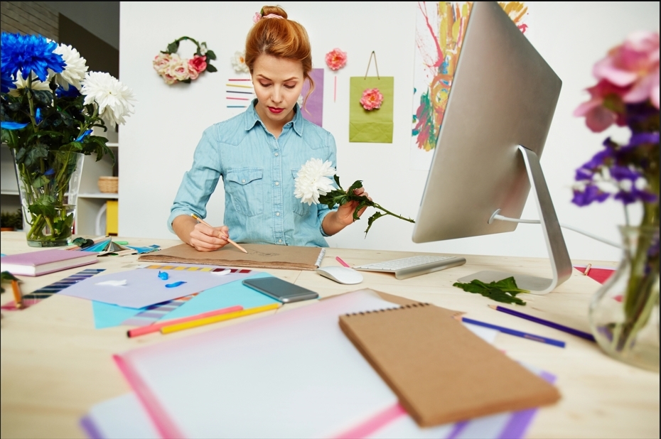 Creative professional brainstorming what is a monogram logo using sketches and color palettes.